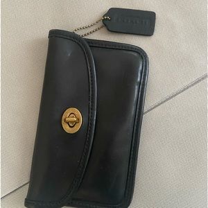 Vintage Coach turn lock clutch/wallet in black.
